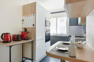 Cuisine ou kitchenette dans l'établissement Les Capucines - Appt proche Talensac avec parking