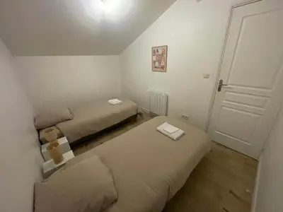 Un ou plusieurs lits dans un hébergement de l'établissement Maison en campagne