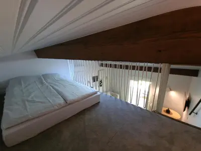 Un ou plusieurs lits dans un hébergement de l'établissement Studio chaleureux de 30m2