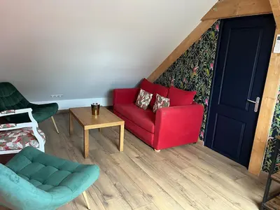 Coin salon dans l'établissement Appartement privé sans cuisine
