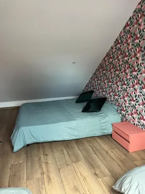 Un ou plusieurs lits dans un hébergement de l'établissement Appartement privé sans cuisine