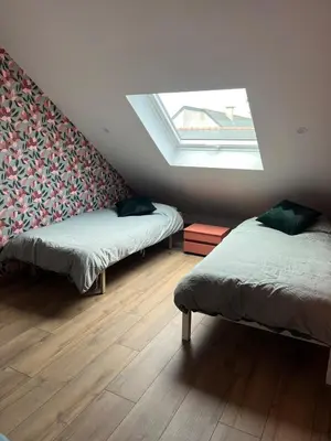 Un ou plusieurs lits dans un hébergement de l'établissement Appartement privé sans cuisine