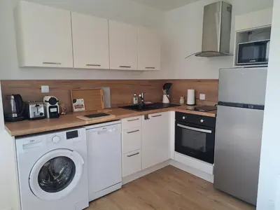 Cuisine ou kitchenette dans l'établissement 900 m Océan, Les Enclos, Vue panoramique Marais Breton