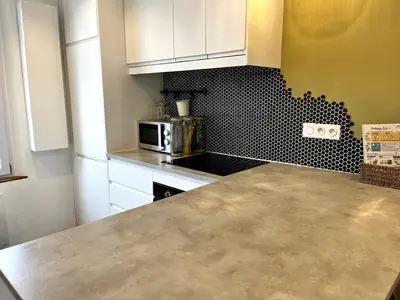 Cuisine ou kitchenette dans l'établissement Intemporel 4 pers 2 chambres TV WiFi