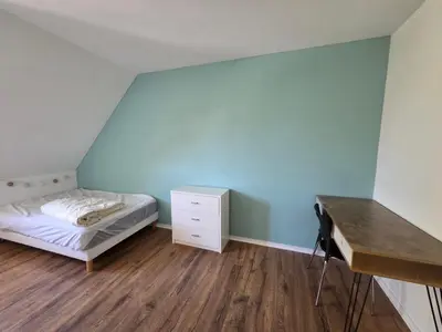 Un ou plusieurs lits dans un hébergement de l'établissement MAISON FAMILIALE 4 CHAMBRE PISCINE 5mn DU CENTRE VILLE