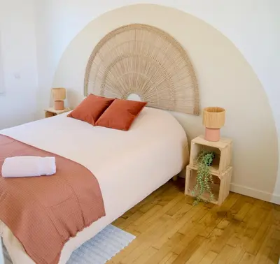 Un ou plusieurs lits dans un hébergement de l'établissement Les Dunes, cosy et chaleureux