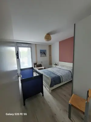 Un ou plusieurs lits dans un hébergement de l'établissement Appartement