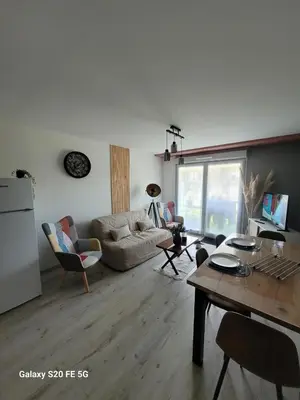 Coin salon dans l'établissement Appartement