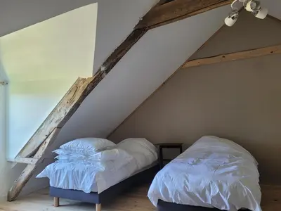 Un ou plusieurs lits dans un hébergement de l'établissement Château de la Garlais - 29 couchages