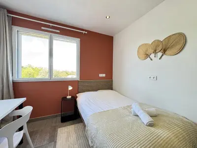 Un ou plusieurs lits dans un hébergement de l'établissement Le Tertre - Wifi Fibre, TV, 2 Parkings, Moderne