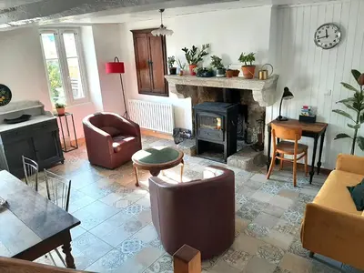 Coin salon dans l'établissement Charmante maison