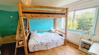 Un ou plusieurs lits dans un hébergement de l'établissement Maison avec jardin proche des bords de Loire
