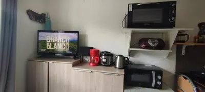 Télévision ou salle de divertissement dans l'établissement Studio calme