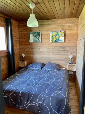 Un ou plusieurs lits dans un hébergement de l'établissement Le Chalet 20min PuyduFou