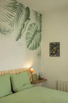 Un ou plusieurs lits dans un hébergement de l'établissement Jungle Studio - Déco tropicale et confort moderne