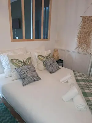 Un ou plusieurs lits dans un hébergement de l'établissement ღ Pirates des Caraïbes - Parking, Terrasse, Wifi