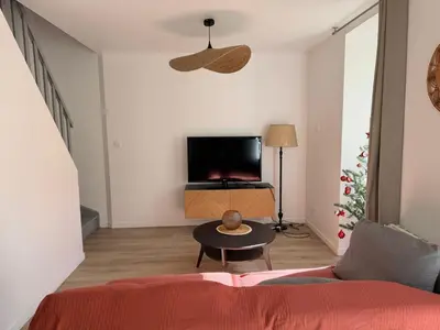 Télévision ou salle de divertissement dans l'établissement Comme à la maison