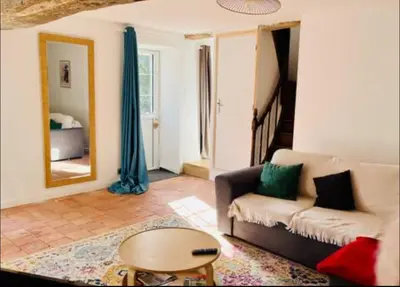 Un ou plusieurs lits dans un hébergement de l'établissement Charmante maison avec jardin dans le cœur de Savennières