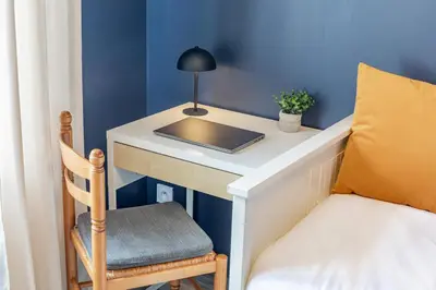 Un ou plusieurs lits dans un hébergement de l'établissement Hyper Centre Wi-Fi fibre pro Le Bleu Savane