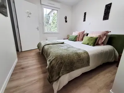 Un ou plusieurs lits dans un hébergement de l'établissement Gîte et chambre d'hôte pour 2 personnes dans Mon Savoureux Jardin