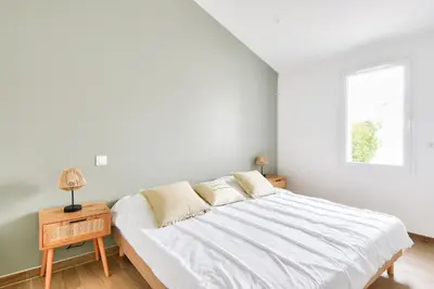 Un ou plusieurs lits dans un hébergement de l'établissement Plage à 400 m - Maison pour 4 avec terrasse