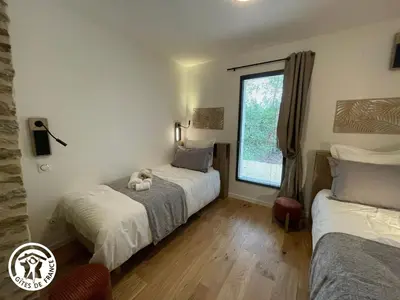 Un ou plusieurs lits dans un hébergement de l'établissement Gîte Vendée avec Spa et Terrasse - FR-1-426-592