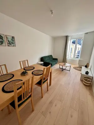 Coin salon dans l'établissement Charmant appartement tout confort