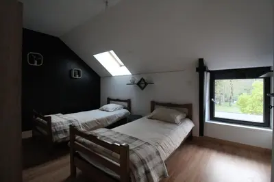 Un ou plusieurs lits dans un hébergement de l'établissement Maison en pierre lumineuse avec véranda & jardin clos, 8 pers entre Nantes et la mer