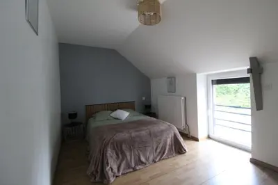 Un ou plusieurs lits dans un hébergement de l'établissement Maison en pierre lumineuse avec véranda & jardin clos, 8 pers entre Nantes et la mer