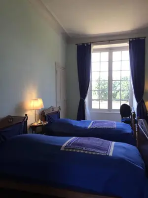Un ou plusieurs lits dans un hébergement de l'établissement Chateau De Piedouault