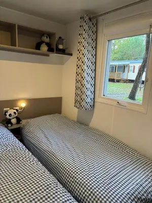 Un ou plusieurs lits dans un hébergement de l'établissement Mobil-home 8 personnes proche plage et foret