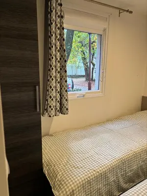 Un ou plusieurs lits dans un hébergement de l'établissement Mobil-home 8 personnes proche plage et foret