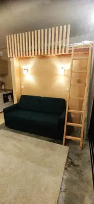 Un ou plusieurs lits dans un hébergement de l'établissement Studio bois indépendant aux portes de Nantes