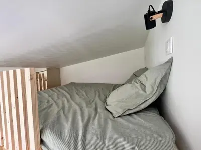 Un ou plusieurs lits dans un hébergement de l'établissement Studio bois indépendant aux portes de Nantes