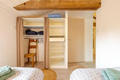Un ou plusieurs lits dans un hébergement de l'établissement L'Atelier Jolie maison de charme proche Puy duFou