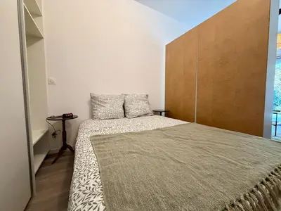 Un ou plusieurs lits dans un hébergement de l'établissement Appartement Cosy Bord de Lac