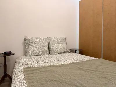 Un ou plusieurs lits dans un hébergement de l'établissement Appartement Cosy Bord de Lac