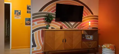 Télévision ou salle de divertissement dans l'établissement Colorama