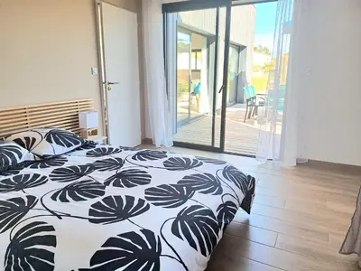 Un ou plusieurs lits dans un hébergement de l'établissement La Dunette - Maison avec spa extérieur