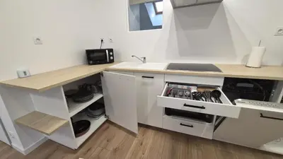 Cuisine ou kitchenette dans l'établissement Appartement cosy neuf en plein centre