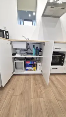 Cuisine ou kitchenette dans l'établissement Appartement cosy neuf en plein centre