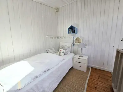 Un ou plusieurs lits dans un hébergement de l'établissement Charmante maison 7 couchages à 300m de la plage, parking et animaux admis - FR-1-777-45