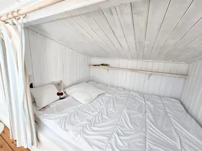 Un ou plusieurs lits dans un hébergement de l'établissement Charmante maison 7 couchages à 300m de la plage, parking et animaux admis - FR-1-777-45