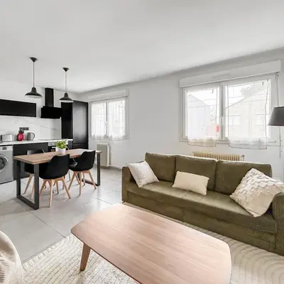 Coin salon dans l'établissement Appartement cosy, plage et parking privé
