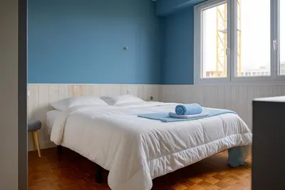 Un ou plusieurs lits dans un hébergement de l'établissement Appartement chaleureux - 4 personnes