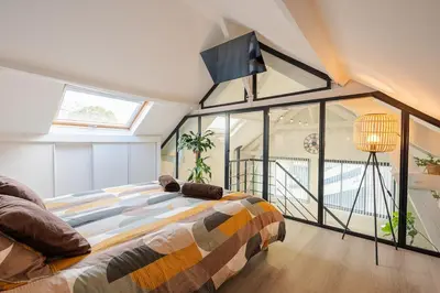 Un ou plusieurs lits dans un hébergement de l'établissement Le Loft, chic et cozy