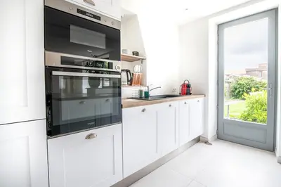 Cuisine ou kitchenette dans l'établissement Maison du Château, spacieuse et charmante près du PuyDuFou