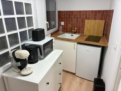 Cuisine ou kitchenette dans l'établissement Studio Cozy avec terrasse idéalement situé