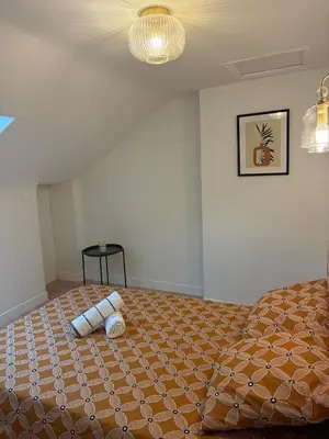 Un ou plusieurs lits dans un hébergement de l'établissement 2 chambre appartement avec vue sur la cathédrale - Coeur d'Angers