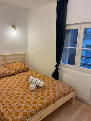 Un ou plusieurs lits dans un hébergement de l'établissement Appartement Chic 4 personnes - Plein Centre Historique